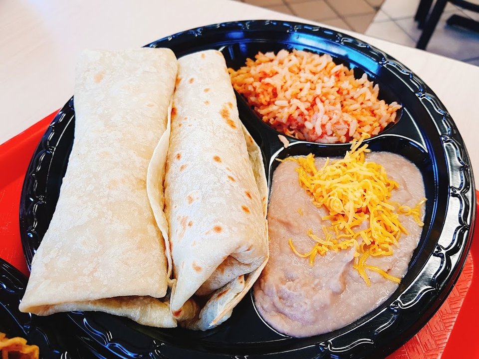 Menu section listing tacos, sides, and extras.