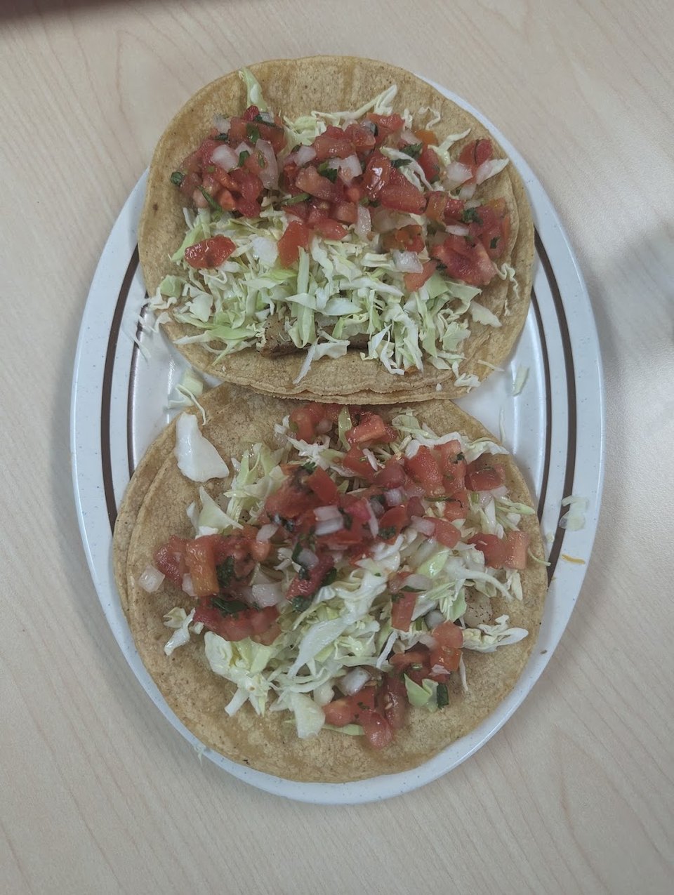 Printed menu with burritos and quesadillas.