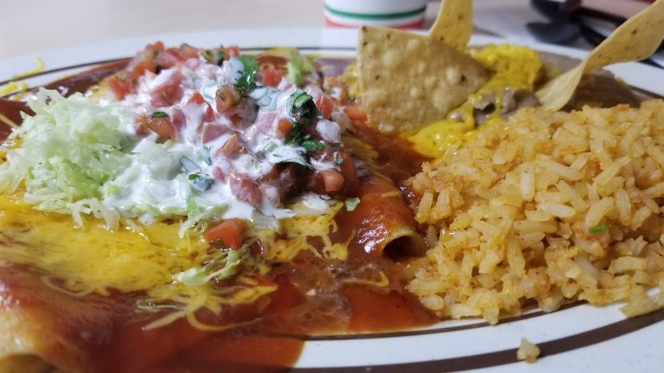 Printed menu with burritos and quesadillas.
